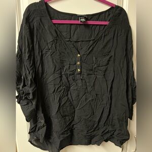 New without tags. Black lightweight top with gold pyramid style embellishments.